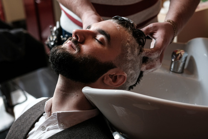 Man getting Shampoo Cut and Beard Trim